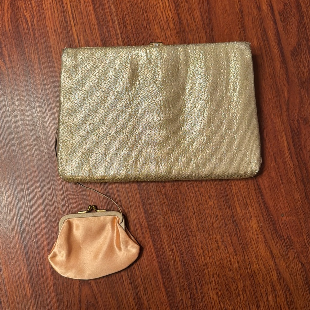 Harry Levine hold vintage clutch with pouch